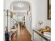 Elegant hallway with hardwood floors, white walls, and an arched entryway, showcasing a bright and open space at 3246 Spicy Cedar Ln, Lithonia, GA 30038
