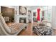 Elegant living room with a fireplace, hardwood floors, and open shelving, creating a cozy atmosphere at 3246 Spicy Cedar Ln, Lithonia, GA 30038