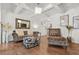 Spacious living room with hardwood floors, coffered ceilings, and ample seating, creating a comfortable living area at 3246 Spicy Cedar Ln, Lithonia, GA 30038
