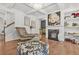 Inviting living room with a fireplace, hardwood floors, and coffered ceilings, offering a luxurious feel at 3246 Spicy Cedar Ln, Lithonia, GA 30038