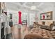 Stylish living room featuring hardwood floors, coffered ceilings, and an open floor plan to the kitchen at 3246 Spicy Cedar Ln, Lithonia, GA 30038