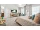 Bright main bedroom with a decorative bed, dual windows, and stylish decor at 3246 Spicy Cedar Ln, Lithonia, GA 30038