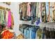 Walk-in closet with ample storage space and organized hanging racks at 3246 Spicy Cedar Ln, Lithonia, GA 30038