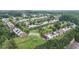 Neighborhood aerial view showing community layout, tree coverage, and surrounding landscape at 401 Buckboard Ln, Locust Grove, GA 30248