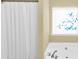 A close-up view of a bathtub with shower at 401 Buckboard Ln, Locust Grove, GA 30248
