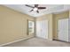 Bedroom featuring double closets and an exterior window at 401 Buckboard Ln, Locust Grove, GA 30248