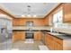 Beautiful kitchen featuring wooden cabinets and stainless-steel appliances at 401 Buckboard Ln, Locust Grove, GA 30248