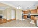 Bright kitchen features stainless steel appliances, hardwood floors, and granite countertops at 401 Buckboard Ln, Locust Grove, GA 30248