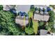 Aerial of townhome with well-manicured lawn and an inviting outdoor living space at 5965 Vista Brook Dr, Suwanee, GA 30024