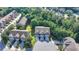 Aerial view of townhomes in a suburban neighborhood surrounded by many trees at 5965 Vista Brook Dr, Suwanee, GA 30024