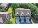 Aerial view of townhome with gray roof, dormers, and landscaping in front at 5965 Vista Brook Dr, Suwanee, GA 30024