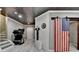 Finished basement with a home gym and an American flag sliding barn door at 5965 Vista Brook Dr, Suwanee, GA 30024