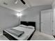 Bright bedroom includes a ceiling fan and plush carpeting at 5965 Vista Brook Dr, Suwanee, GA 30024