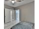 Bedroom with light-colored flooring, ceiling fan, and multiple doorways at 5965 Vista Brook Dr, Suwanee, GA 30024