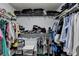 Walk-in closet with built-in shelving and hanging racks at 5965 Vista Brook Dr, Suwanee, GA 30024