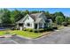 Charming blue and green clubhouse is professionally landscaped and next to community tennis courts at 5965 Vista Brook Dr, Suwanee, GA 30024