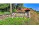 Stone sign reads 'Hillside Trace' and is surrounded by unkempt brush and landscaping at 5965 Vista Brook Dr, Suwanee, GA 30024