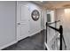 Upstairs hallway boasting dark hardwood floors and a modern chandelier at 5965 Vista Brook Dr, Suwanee, GA 30024