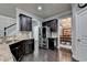 Bright kitchen with stainless steel appliances and dark wood cabinets at 5965 Vista Brook Dr, Suwanee, GA 30024