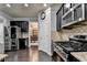 Spacious kitchen with stainless steel appliances, dark wood cabinets, and granite countertops at 5965 Vista Brook Dr, Suwanee, GA 30024