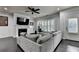 Living room featuring a fireplace, ceiling fan, and comfortable seating at 5965 Vista Brook Dr, Suwanee, GA 30024