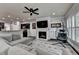 Inviting living room featuring a fireplace, ceiling fan, and modern decor at 5965 Vista Brook Dr, Suwanee, GA 30024