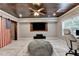 Finished basement with wood ceiling, entertainment area, and ample seating at 5965 Vista Brook Dr, Suwanee, GA 30024