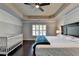 Bright main bedroom with hardwood floors and ceiling fan at 5965 Vista Brook Dr, Suwanee, GA 30024