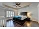 Spacious main bedroom featuring trey ceilings, ceiling fan, and hardwood floors at 5965 Vista Brook Dr, Suwanee, GA 30024