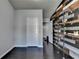 Home office with a accent wall and built-in shelving at 5965 Vista Brook Dr, Suwanee, GA 30024