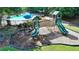 A charming community playground with slides, swings, and a soft landing surface at 5965 Vista Brook Dr, Suwanee, GA 30024