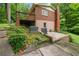 The house exterior showing the outdoor patio and lush landscaping surrounding the property at 1103 Lee Ne Cir, Atlanta, GA 30324