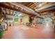 Unfinished basement with exposed ceiling, ample storage, and workbench space at 1103 Lee Ne Cir, Atlanta, GA 30324