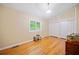 Bright bedroom featuring wood floors, a large window, and ample closet space at 1103 Lee Ne Cir, Atlanta, GA 30324