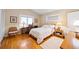 Cozy bedroom with hardwood floors, large windows, and vintage furnishings at 1103 Lee Ne Cir, Atlanta, GA 30324