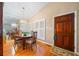 Dining room with hardwood floors, a chandelier, and a large window for natural light at 1103 Lee Ne Cir, Atlanta, GA 30324