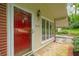 A stylish red door, stone entrance, and large multi-pane window add curb appeal to this charming home at 1103 Lee Ne Cir, Atlanta, GA 30324