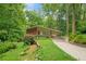 Charming single-story house with a covered carport surrounded by lush landscaping at 1103 Lee Ne Cir, Atlanta, GA 30324