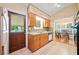 Traditional kitchen with tile floors, wood cabinets, and a view into the adjacent dining area at 1103 Lee Ne Cir, Atlanta, GA 30324