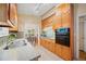 Bright kitchen with light wood cabinets, granite counters, stainless steel sink, and appliances at 1103 Lee Ne Cir, Atlanta, GA 30324