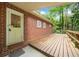 An outdoor wooden deck with a brick exterior, perfect for enjoying the surrounding natural landscape at 1103 Lee Ne Cir, Atlanta, GA 30324