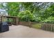 Large back deck with wood railing, a grill, and covered sitting area at 3711 Frey Lake Nw Rd, Kennesaw, GA 30144