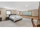 Spacious bedroom with neutral carpet and large windows providing natural light at 3711 Frey Lake Nw Rd, Kennesaw, GA 30144