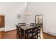 Elegant dining room with hardwood floors and adjacent kitchen at 3711 Frey Lake Nw Rd, Kennesaw, GA 30144