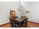 Formal dining room with elegant chandelier and hardwood floors at 3711 Frey Lake Nw Rd, Kennesaw, GA 30144
