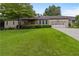 Charming home with a well-manicured lawn and mature trees at 3711 Frey Lake Nw Rd, Kennesaw, GA 30144