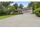 Inviting home with a long driveway and an attached two-car garage at 3711 Frey Lake Nw Rd, Kennesaw, GA 30144