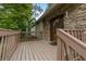 Inviting porch with stone accents and a wood railing at 3711 Frey Lake Nw Rd, Kennesaw, GA 30144