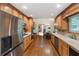 Spacious kitchen with stainless steel appliances, wood cabinets, and hardwood floors at 3711 Frey Lake Nw Rd, Kennesaw, GA 30144