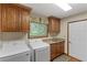 Laundry area with cabinets, sink, and washer and dryer at 3711 Frey Lake Nw Rd, Kennesaw, GA 30144